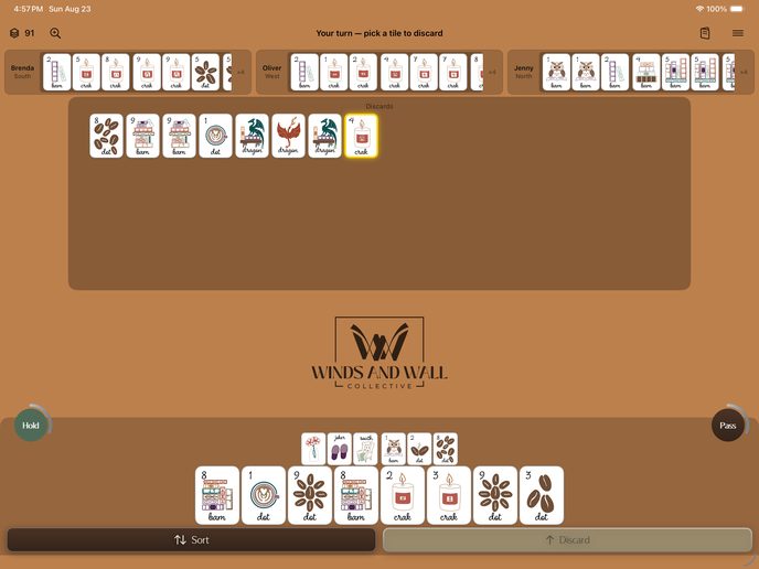 An iPad in landscape on the Cozy tile set, showing all four racks and the discard floor at once